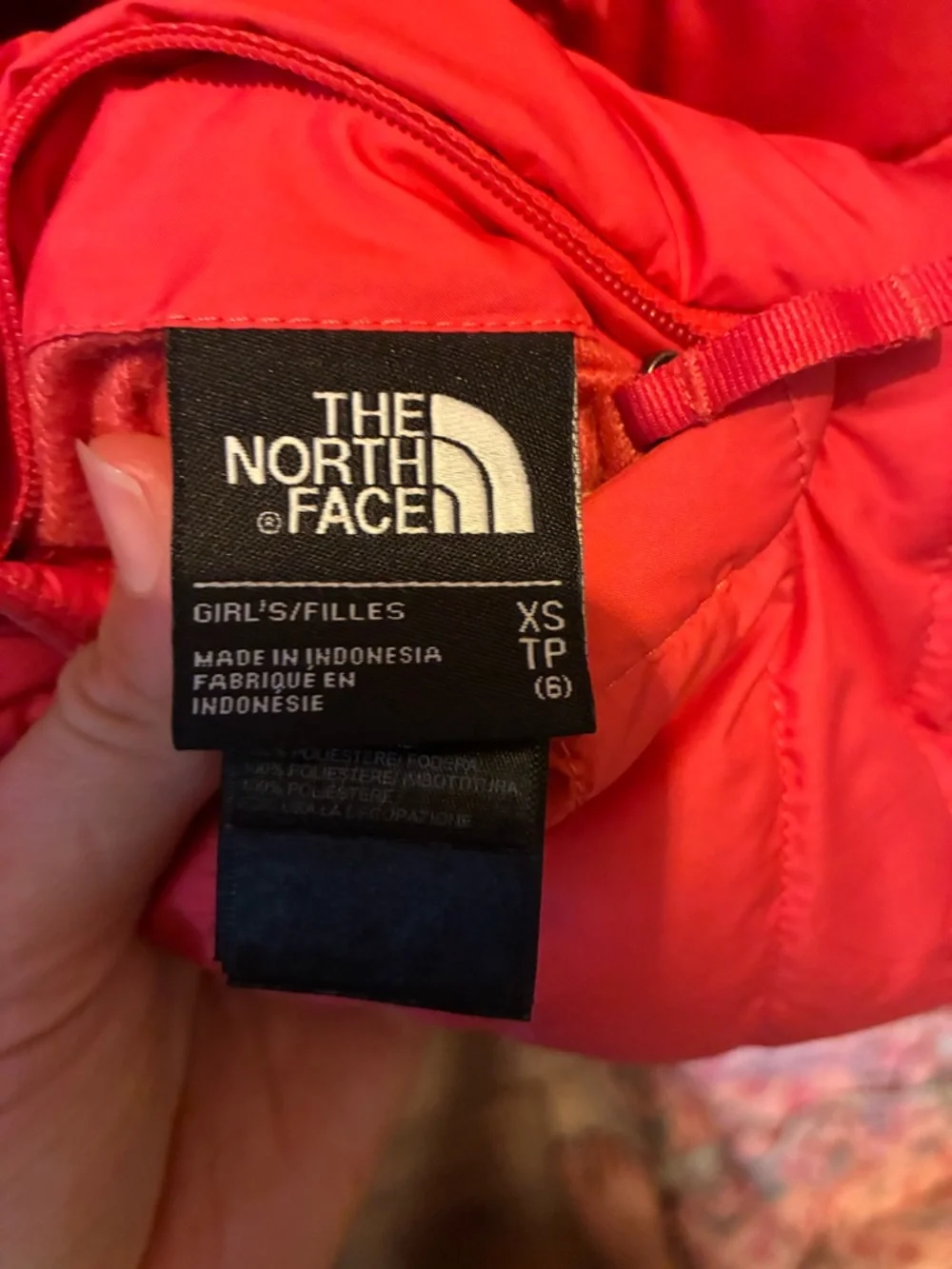 The North Face reversible Kids coral Jacket with Charcoal Fleece Interior.